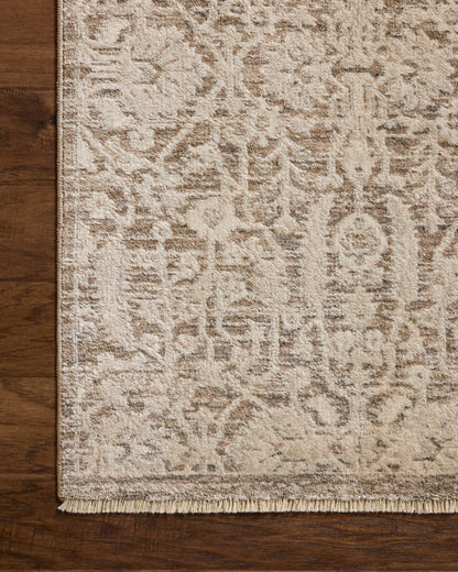 Dressed in misty and bone hues with traditional and floral detail, the Clarisse CLS-06 Fog / Bone Area Rug is a power-loomed polyester area rug that completes any room