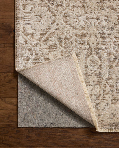 Dressed in misty and bone hues with traditional and floral detail, the Clarisse CLS-06 Fog / Bone Area Rug is a power-loomed polyester area rug that completes any room