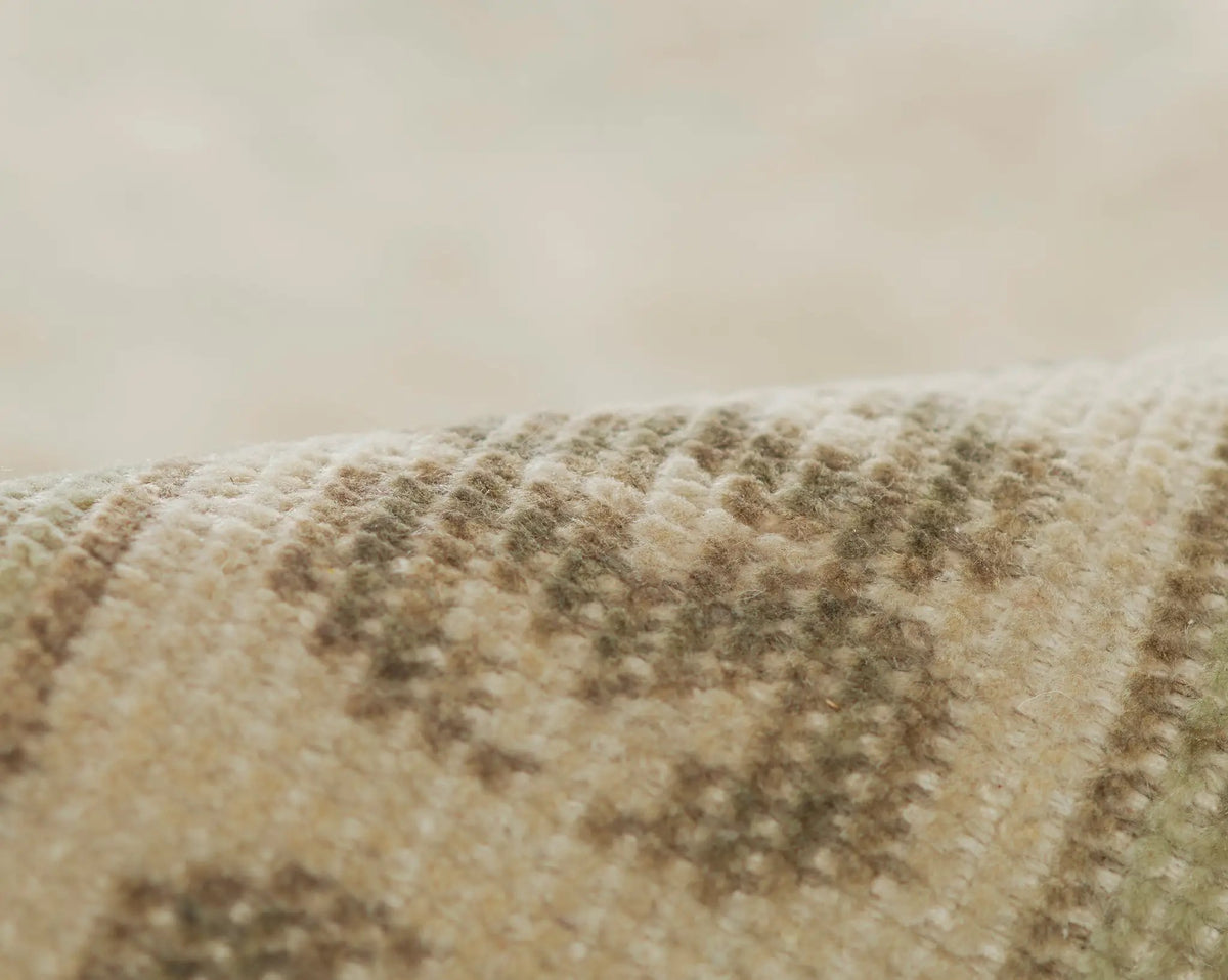 Close-up texture of the Erin Gates by Momeni Sudbury Concord CRD-2 (Sudbury) Beige Area Rug featuring a handcrafted, canyon-inspired weave with classic traditional detailing in sunny neutral tones.
