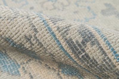 Close-up texture of rolled Erin Gates by Momeni Concord CRD-3 (Lowell) Ivory Area Rug showing soft woven pile and traditional geometric detailing.