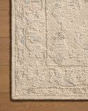 Featuring refined ivory and breezy sky-blue hues and floral detail, the Cynthia CYN-02 Ivory / Sky Area Rug is a hand-tufted wool area rug for any room