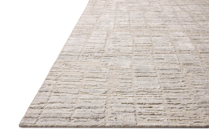 Rich in antique ivory hues with ribbed and graphic detail, the Daniel DAN-01 Antique Ivory Area Rug is a hand-loomed bamboo and wool area rug built for style and comfort