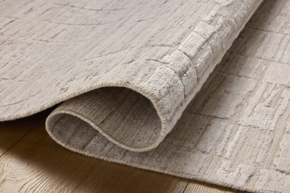 Rich in antique ivory hues with ribbed and graphic detail, the Daniel DAN-01 Antique Ivory Area Rug is a hand-loomed bamboo and wool area rug built for style and comfort