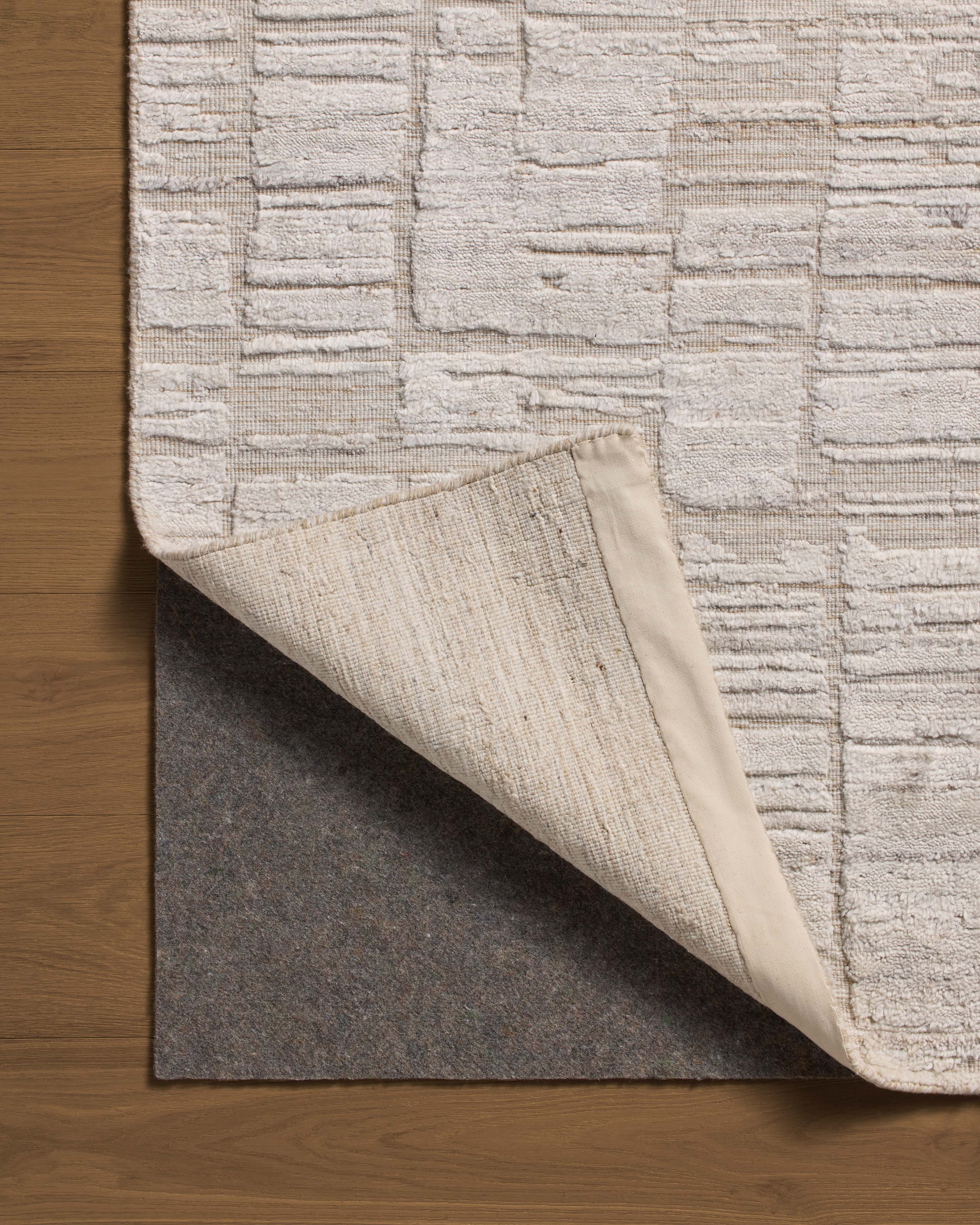Rich in antique ivory hues with ribbed and graphic detail, the Daniel DAN-01 Antique Ivory Area Rug is a hand-loomed bamboo and wool area rug built for style and comfort