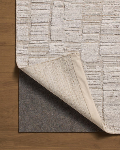 Rich in antique ivory hues with ribbed and graphic detail, the Daniel DAN-01 Antique Ivory Area Rug is a hand-loomed bamboo and wool area rug built for style and comfort