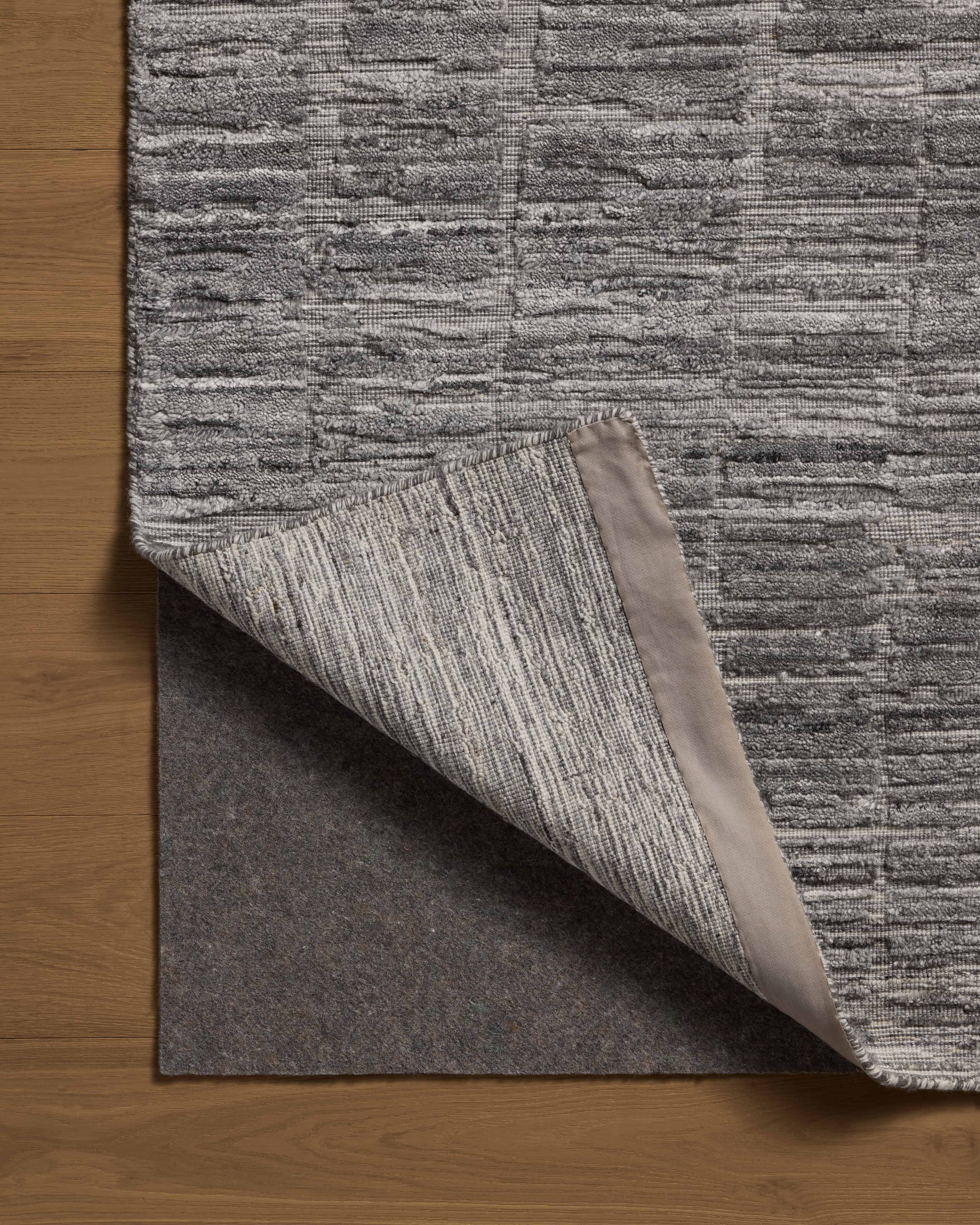 Expertly crafted as a hand-loomed bamboo and wool area rug with ribbed and graphic artistry, the Daniel DAN-01 Slate Area Rug captures cool slate tones beautifully