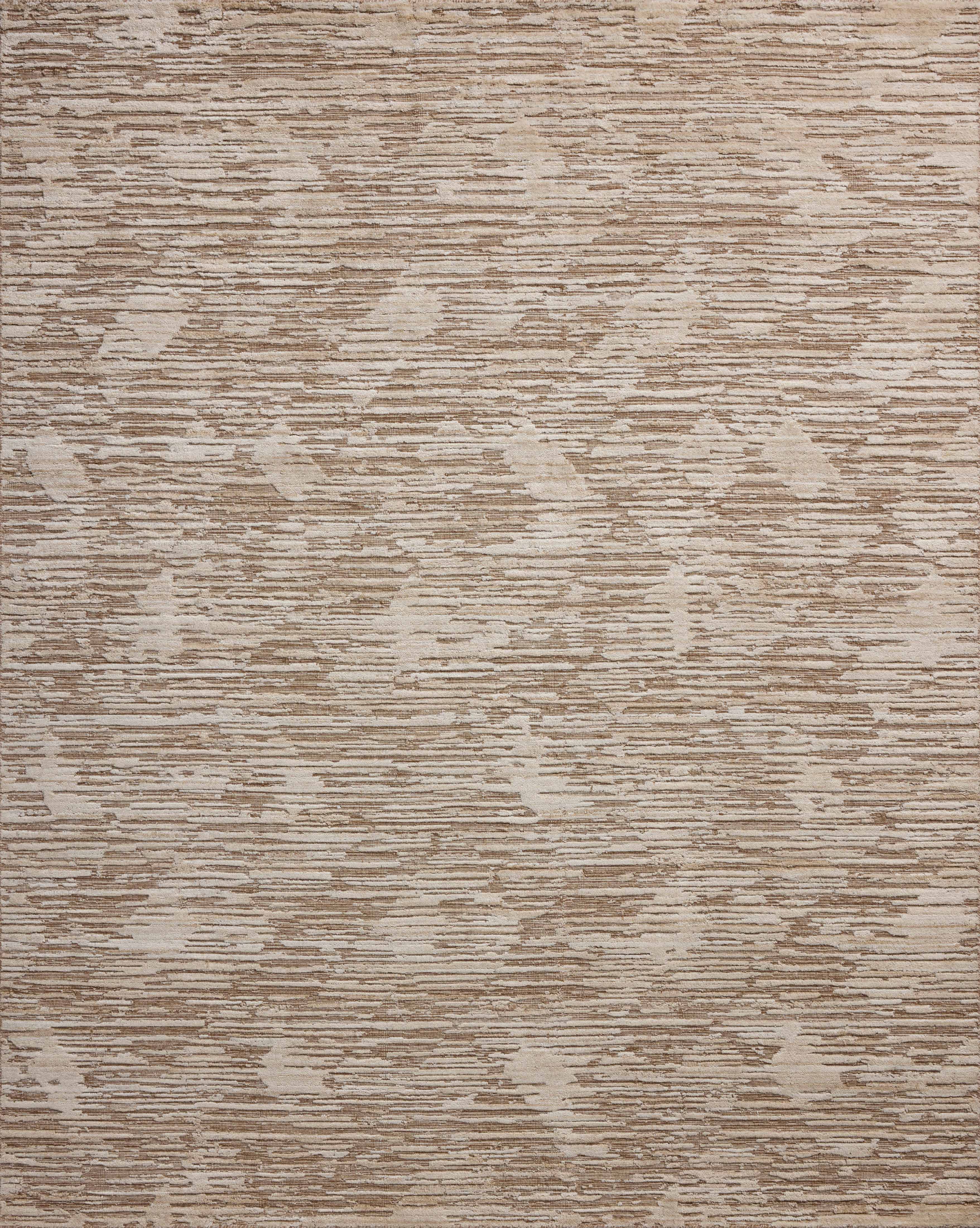 Finished in warm natural tones with ribbed and graphic styling, the Daniel DAN-02 Natural Area Rug is a hand-loomed bamboo and wool area rug for modern living