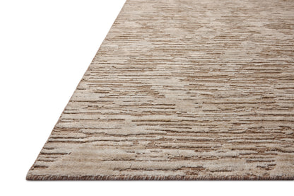 Finished in warm natural tones with ribbed and graphic styling, the Daniel DAN-02 Natural Area Rug is a hand-loomed bamboo and wool area rug for modern living