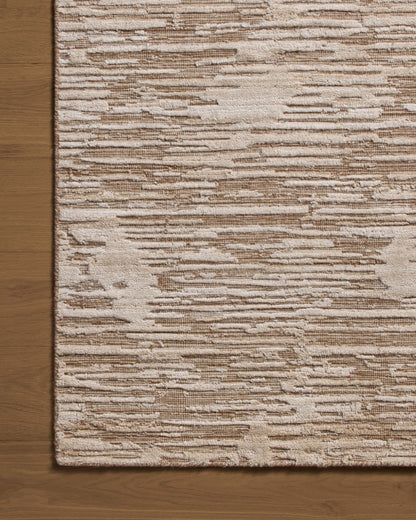 Finished in warm natural tones with ribbed and graphic styling, the Daniel DAN-02 Natural Area Rug is a hand-loomed bamboo and wool area rug for modern living