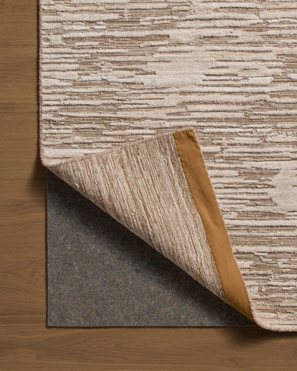 Finished in warm natural tones with ribbed and graphic styling, the Daniel DAN-02 Natural Area Rug is a hand-loomed bamboo and wool area rug for modern living
