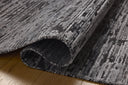 A hand-loomed bamboo and wool area rug with ribbed and graphic design in deep charcoal hues, the Daniel DAN-03 Charcoal Area Rug is a standout in any décor