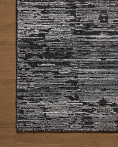 A hand-loomed bamboo and wool area rug with ribbed and graphic design in deep charcoal hues, the Daniel DAN-03 Charcoal Area Rug is a standout in any décor