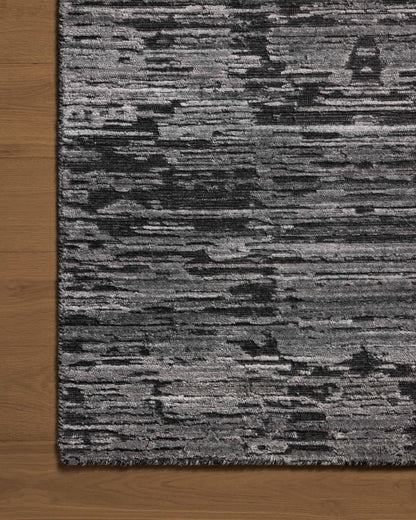 A hand-loomed bamboo and wool area rug with ribbed and graphic design in deep charcoal hues, the Daniel DAN-03 Charcoal Area Rug is a standout in any décor