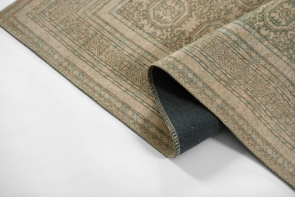 Erin Gates by Momeni Dorset DOR-1 green area rug featuring vintage pattern, stitched border, and dark non-slip backing rolled on white background.