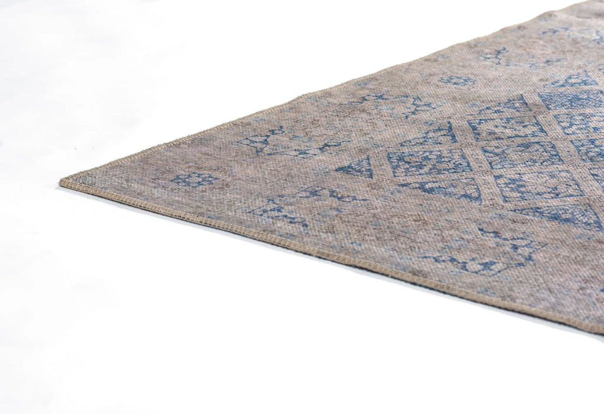 Erin Gates by Momeni Dorset DOR-3 blue and beige vintage-style area rug with distressed geometric patterns and bound edge