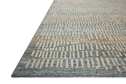 The Elias ELA-02 Ocean / Oatmeal Area Rug combines serene ocean and cozy oatmeal tones and graphic and high-low textured patterns in a hand-tufted wool area rug for effortless elegance