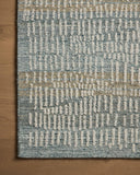 The Elias ELA-02 Ocean / Oatmeal Area Rug combines serene ocean and cozy oatmeal tones and graphic and high-low textured patterns in a hand-tufted wool area rug for effortless elegance