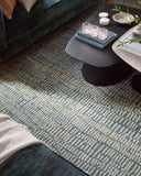 The Elias ELA-02 Ocean / Oatmeal Area Rug combines serene ocean and cozy oatmeal tones and graphic and high-low textured patterns in a hand-tufted wool area rug for effortless elegance