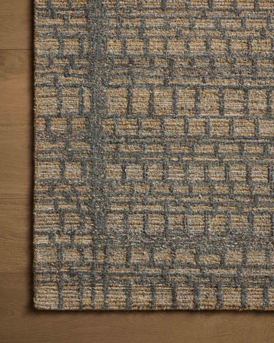 The Elias ELA-05 Wheat / Charcoal Area Rug offers golden wheat and deep charcoal sophistication and graphic and high-low textured charm in a hand-tufted wool area rug