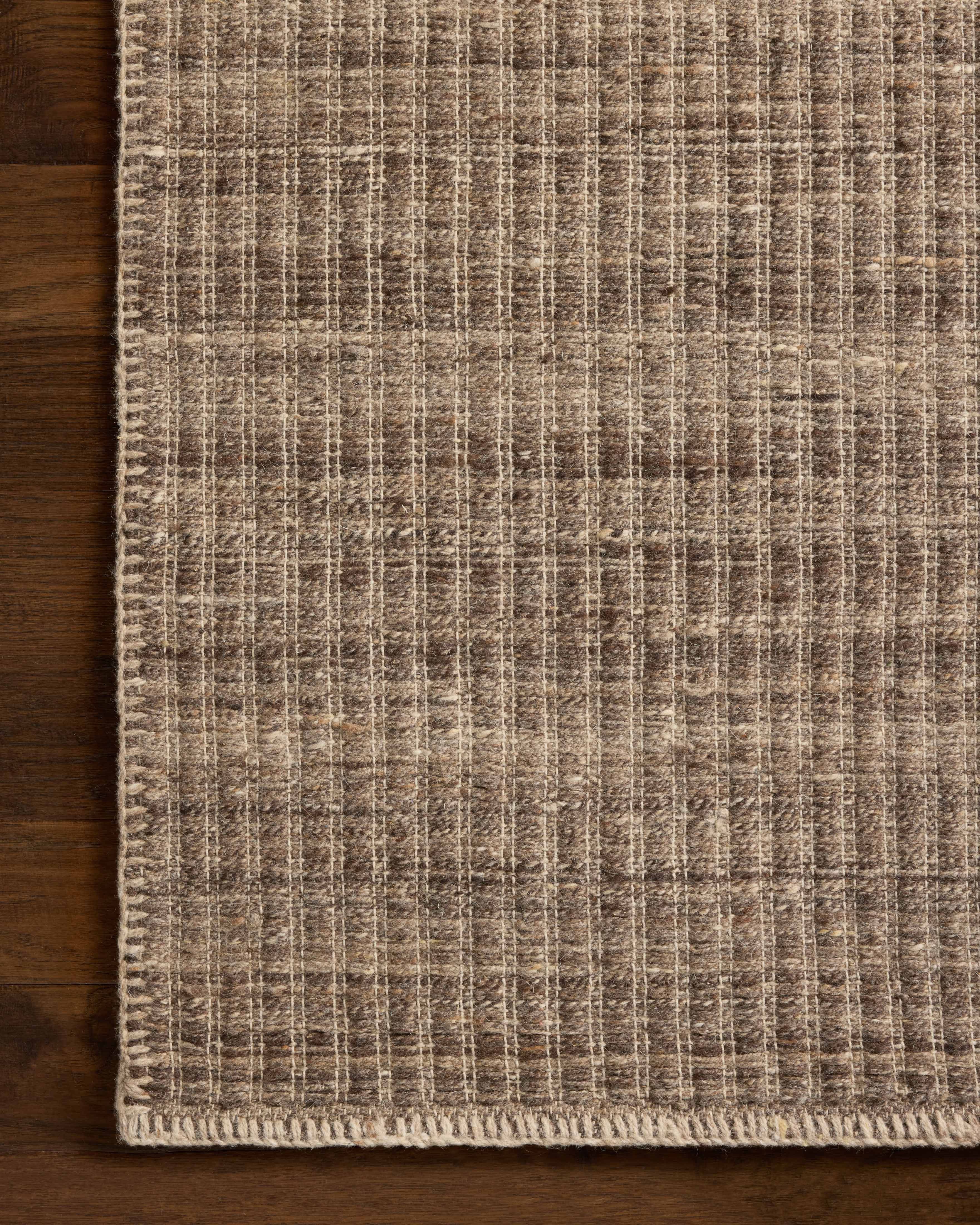 A stunning hand-woven wool and cotton area rug with striped detail, the Elma ELM-01 Bark Area Rug features grounded bark tones for a polished look