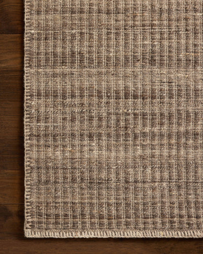 A stunning hand-woven wool and cotton area rug with striped detail, the Elma ELM-01 Bark Area Rug features grounded bark tones for a polished look