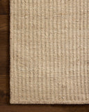 Designed with striped artistry in warm natural hues, the Elma ELM-01 Natural Area Rug is a hand-woven wool and cotton area rug that stands out