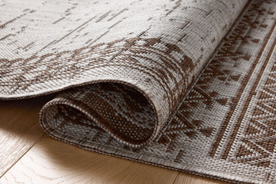 With coffee and gentle dove hues, the Easton ESN-01 Coffee / Dove Area Rug is a power-loomed polypropylene area rug that elevates any room