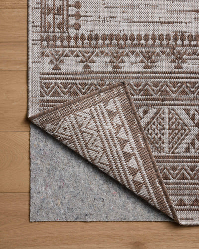 With coffee and gentle dove hues, the Easton ESN-01 Coffee / Dove Area Rug is a power-loomed polypropylene area rug that elevates any room