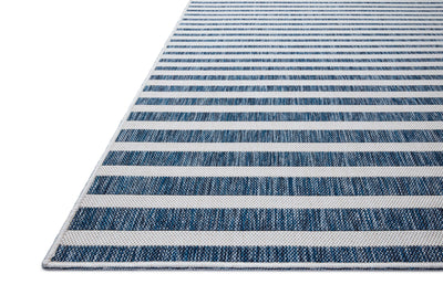 The Easton ESN-03 Denim / Ivory Area Rug delivers casual denim and refined ivory beauty in a power-loomed polypropylene area rug