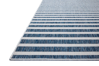 The Easton ESN-03 Denim / Ivory Area Rug delivers casual denim and refined ivory beauty in a power-loomed polypropylene area rug