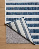 The Easton ESN-03 Denim / Ivory Area Rug delivers casual denim and refined ivory beauty in a power-loomed polypropylene area rug