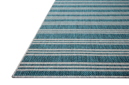 Designed in vibrant teal and misty hues, the Easton ESN-04 Teal / Fog Area Rug is a power-loomed polypropylene area rug that stands out