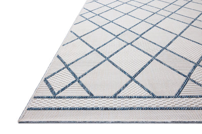 The Easton ESN-08 Ivory / Denim Area Rug offers refined ivory and casual denim sophistication in a power-loomed polypropylene area rug