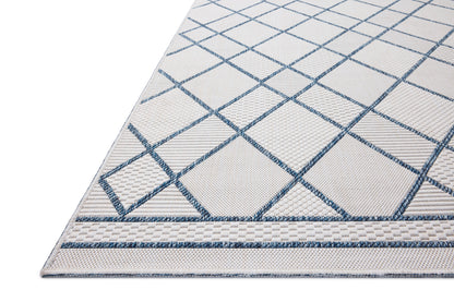 The Easton ESN-08 Ivory / Denim Area Rug offers refined ivory and casual denim sophistication in a power-loomed polypropylene area rug