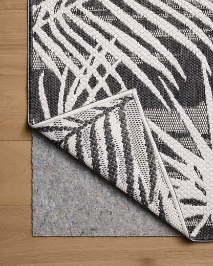 Expertly crafted as a power-loomed polypropylene area rug, the Easton ESN-09 Ivory / Onyx Area Rug captures refined ivory and bold onyx tones beautifully