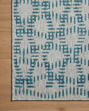 The Easton ESN-10 Fog / Teal Area Rug brings misty and vibrant teal character to your home in a power-loomed polypropylene area rug
