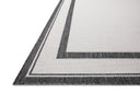 Finished in bold onyx and refined ivory tones, the Easton ESN-11 Onyx / Ivory Area Rug is a power-loomed polypropylene area rug for modern living