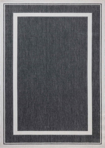 Finished in bold onyx and refined ivory tones, the Easton ESN-11 Onyx / Ivory Area Rug is a power-loomed polypropylene area rug for modern living