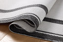 Finished in bold onyx and refined ivory tones, the Easton ESN-11 Onyx / Ivory Area Rug is a power-loomed polypropylene area rug for modern living
