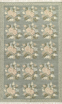 Momeni Florence FLO-1 Blue floral wool area rug with Bessarabian-inspired rose motifs, blush tones, decorative border, and fringed edges.