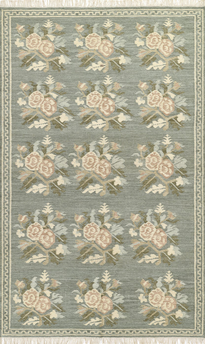 Momeni Florence FLO-1 Blue floral wool area rug with Bessarabian-inspired rose motifs, blush tones, decorative border, and fringed edges.