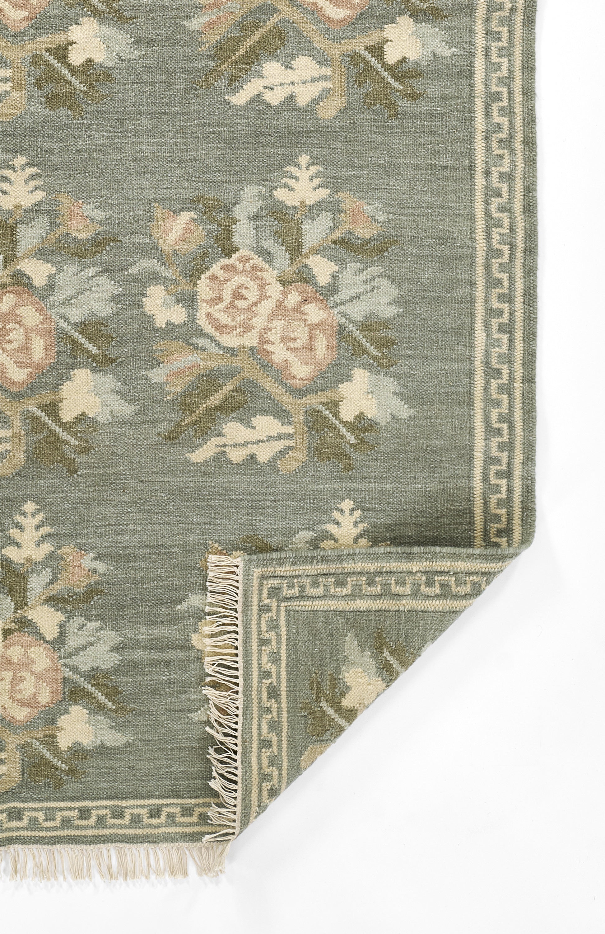 Momeni Florence FLO-1 Blue floral wool area rug with Bessarabian-inspired rose motifs, blush tones, decorative border, and fringed edges.