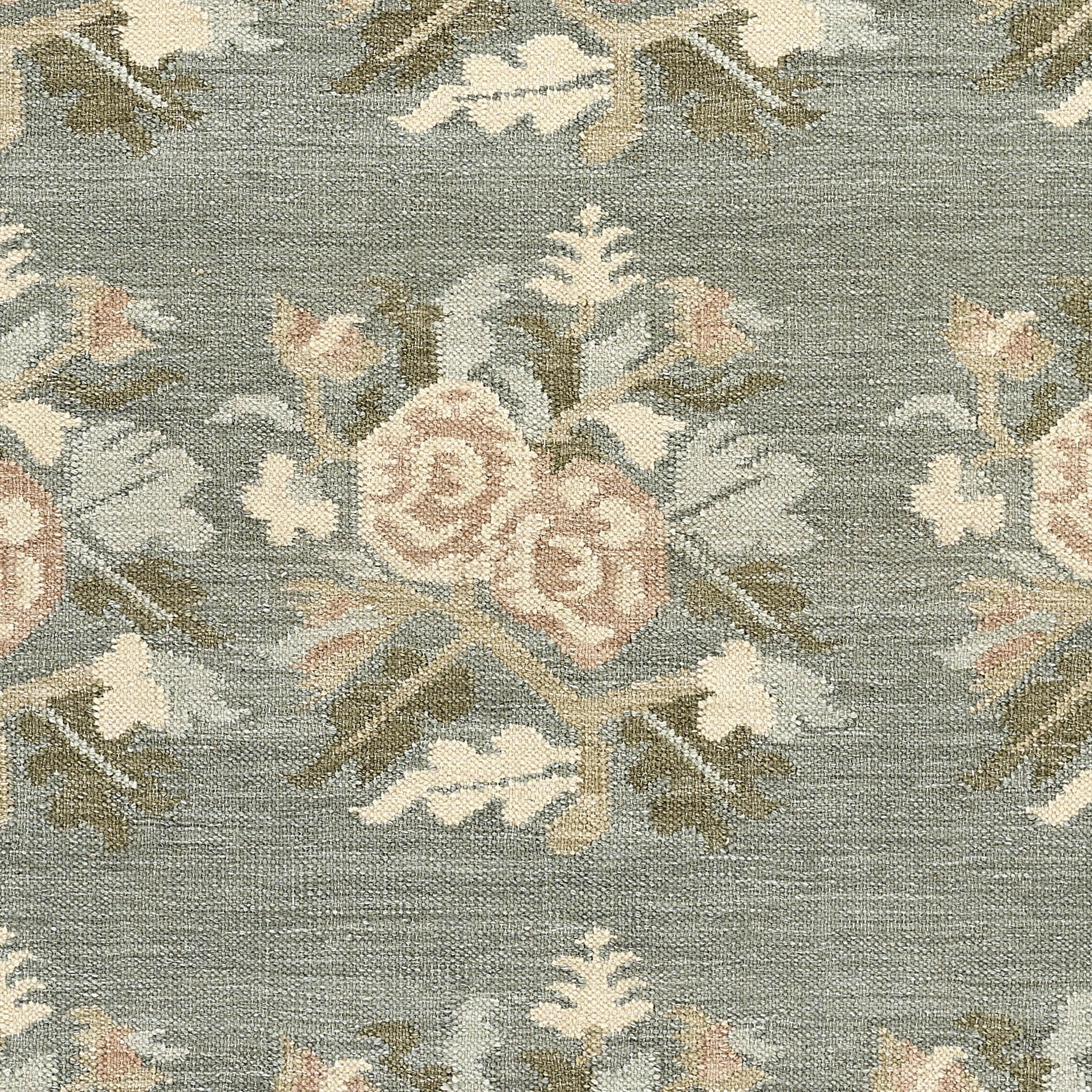 Momeni Florence FLO-1 Blue floral wool area rug with Bessarabian-inspired rose motifs, blush tones, decorative border, and fringed edges.