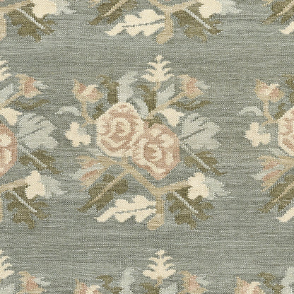 Momeni Florence FLO-1 Blue floral wool area rug with Bessarabian-inspired rose motifs, blush tones, decorative border, and fringed edges.