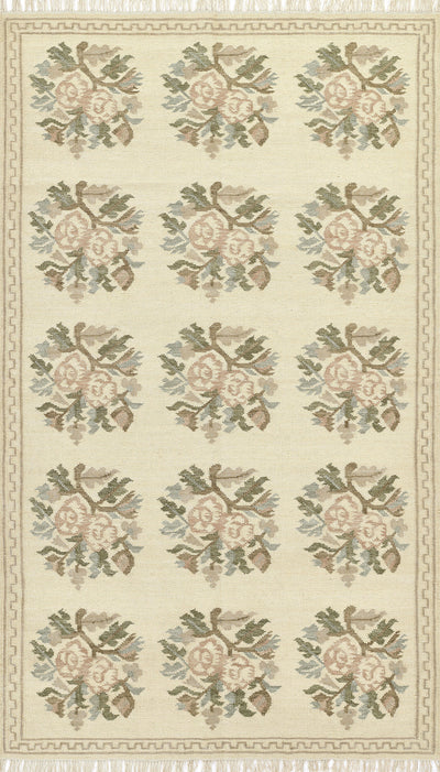 Momeni Florence FLO-1 ivory floral wool area rug with Bessarabian-style rose bouquet design, subtle blue and blush accents, ornamental border, and fringe.