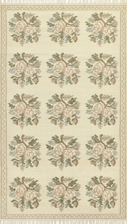 Momeni Florence FLO-1 ivory floral wool area rug with Bessarabian-style rose bouquet design, subtle blue and blush accents, ornamental border, and fringe.