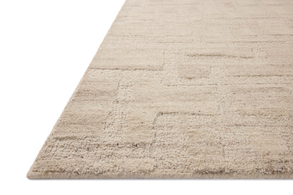Crafted as a hand-tufted wool area rug, the Hartley HRT-01 Ivory / Natural Area Rug brings refined ivory and warm natural warmth and traditional character to your space