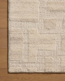 Crafted as a hand-tufted wool area rug, the Hartley HRT-01 Ivory / Natural Area Rug brings refined ivory and warm natural warmth and traditional character to your space