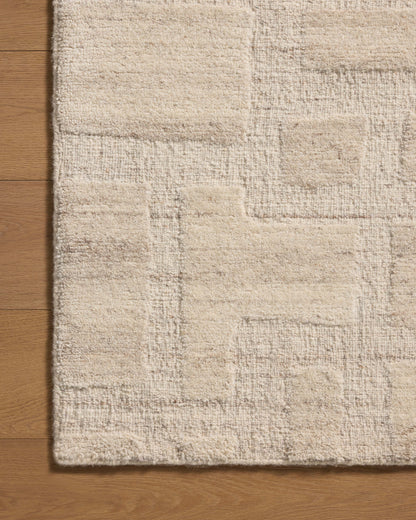 Crafted as a hand-tufted wool area rug, the Hartley HRT-01 Ivory / Natural Area Rug brings refined ivory and warm natural warmth and traditional character to your space