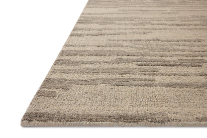 With shimmering silver and elegant grey hues and traditional styling, the Hartley HRT-02 Silver / Grey Area Rug is a hand-tufted wool area rug that elevates any room